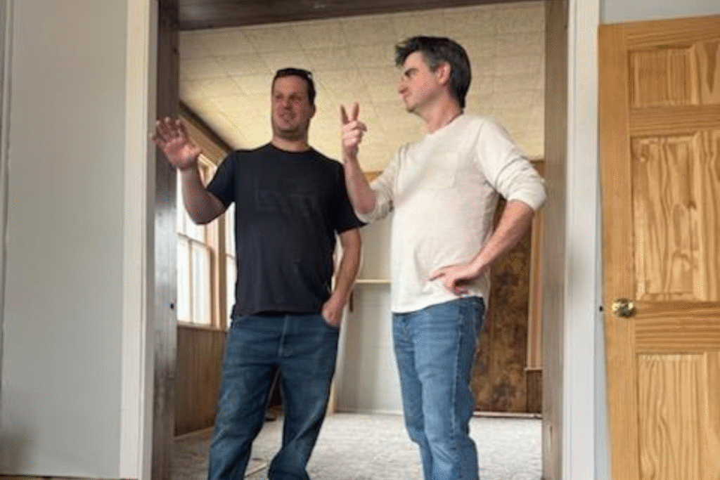 George and a homeowner walking through a property in Nebraska